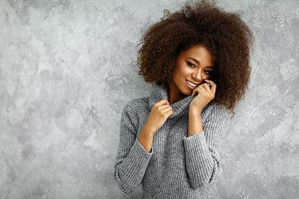 african american woman in cashmere sweater