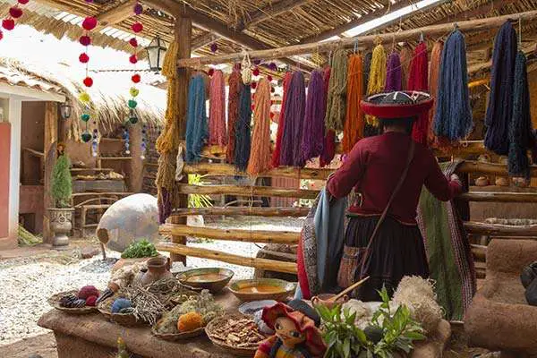 Quechua woman demonstrates the art of weaving in Chinchero