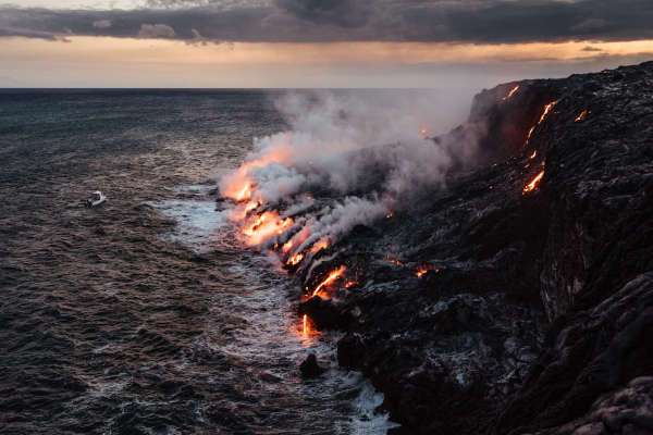 Lava from the Kilauea volcano hitting the ocean