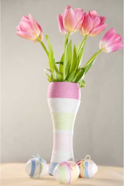 Pink tulips, Easter eggs and yarn wrapped bottle