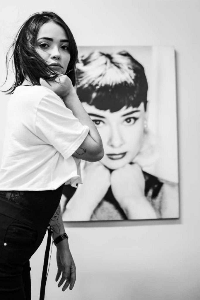 Photo of Woman Standing Near Audrey Hepburn