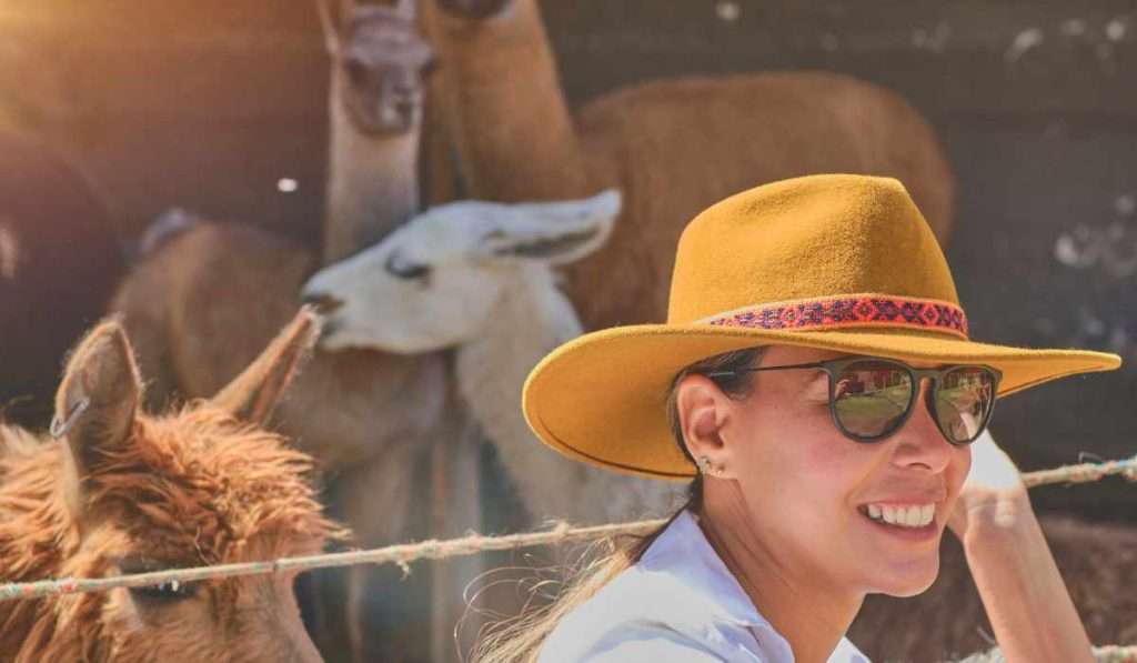 Tourist at Alpaca Farm in Peru